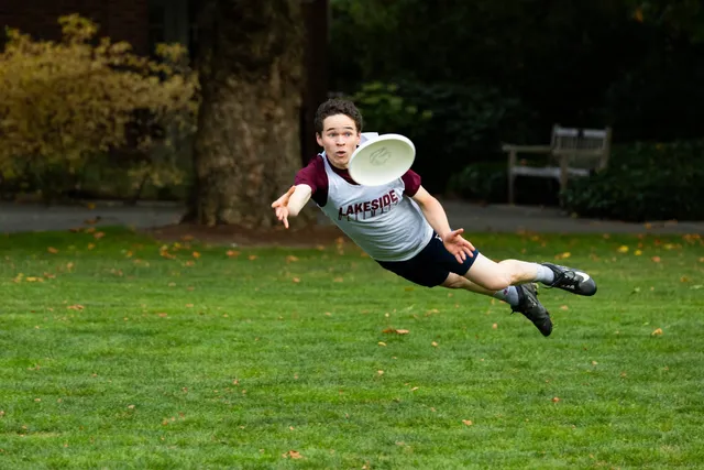 Kellan laying out for a disc on senior night.