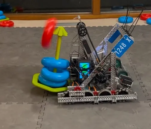 The robot color-sorting game rings.