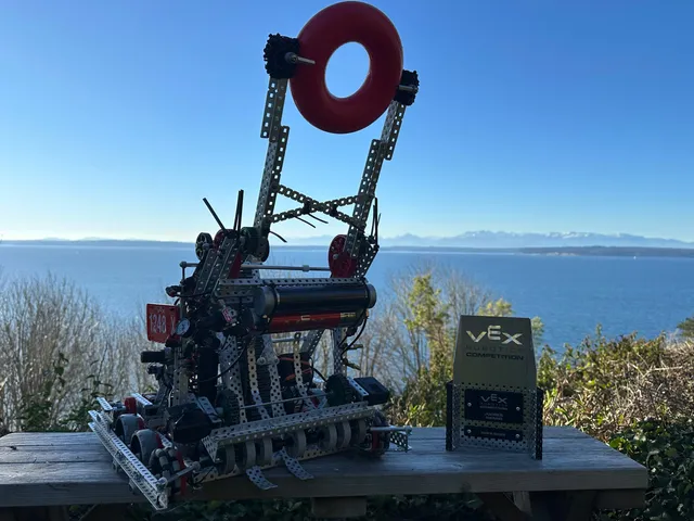 The competition robot next to an award after a tournament.