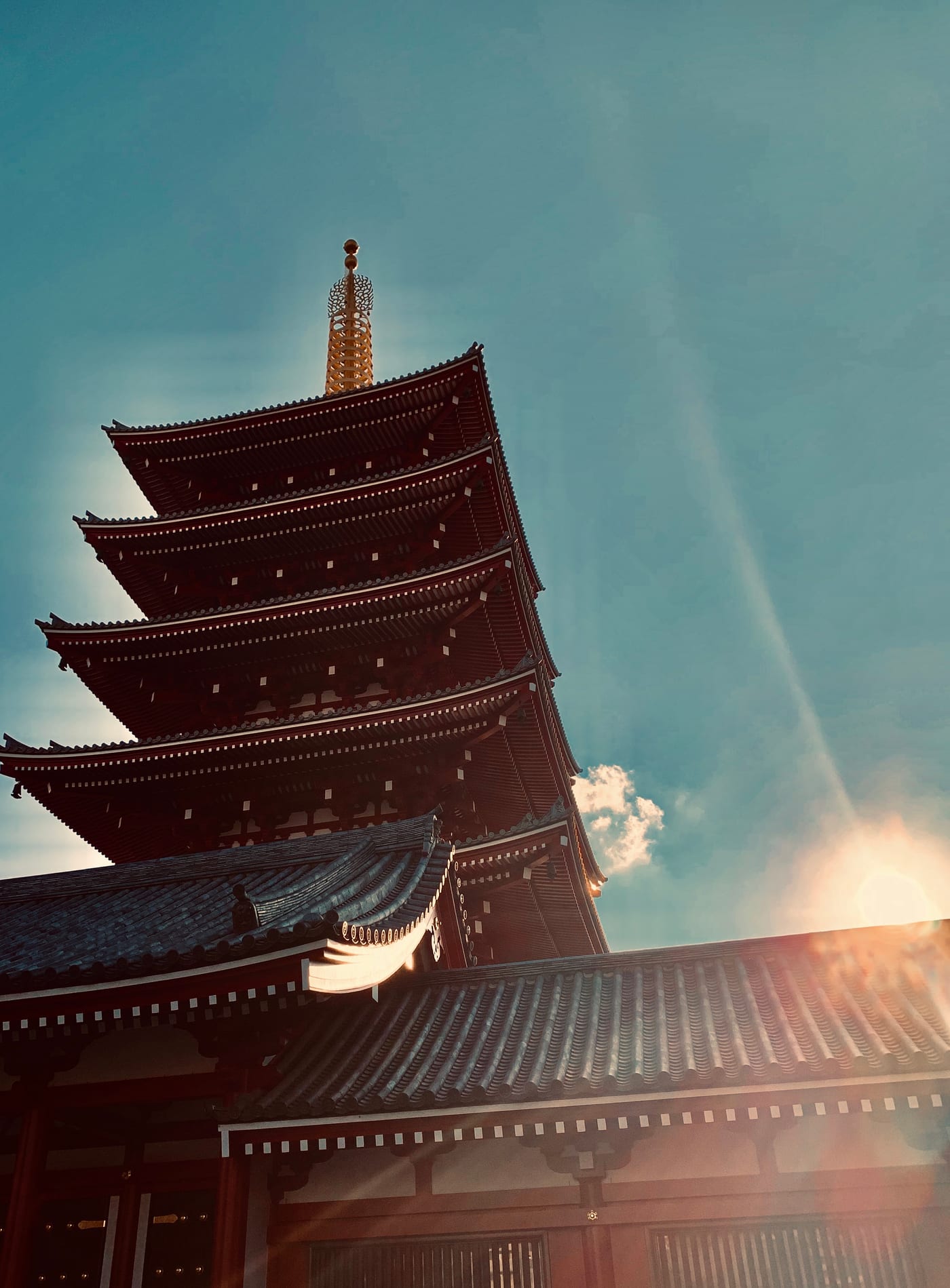 Five-story pagoda under a hazy sky.